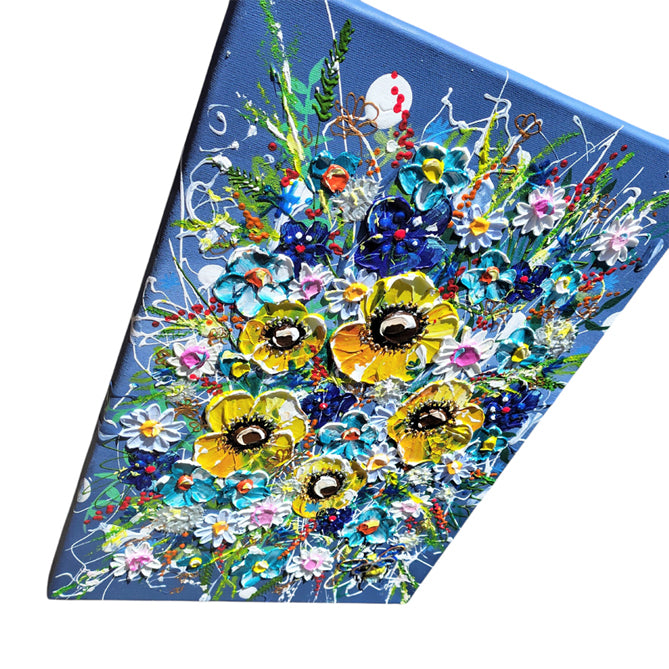 A square canvas painting featuring a vibrant, textured floral bouquet with yellow poppies, blue flowers, and white daisies on a blue background, shown at an angle against a white backdrop.