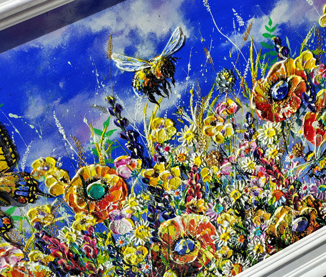 A vibrant, colorful painting depicting a lush wildflower meadow under a bright blue sky, with a large yellow and black bumblebee flying near the top center.